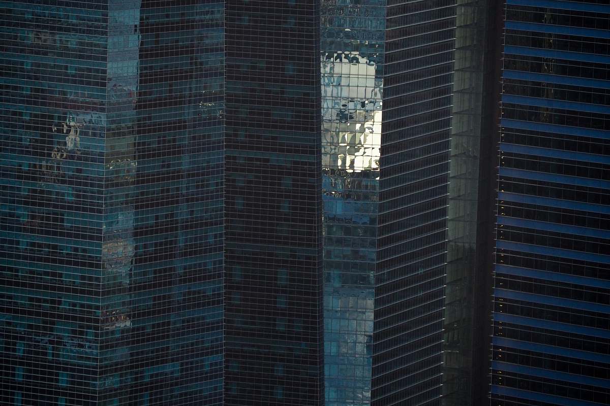 high rise blue curtain glass wall buildings city